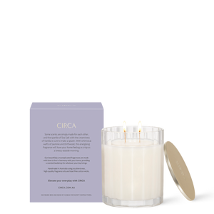 CIRCA Sea Salt and Vanilla 350g Soy Candle burning beside box - back of product shot
