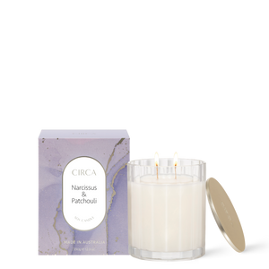 CIRCA Narcissus and Patchouli 350g Soy Candle burning beside box